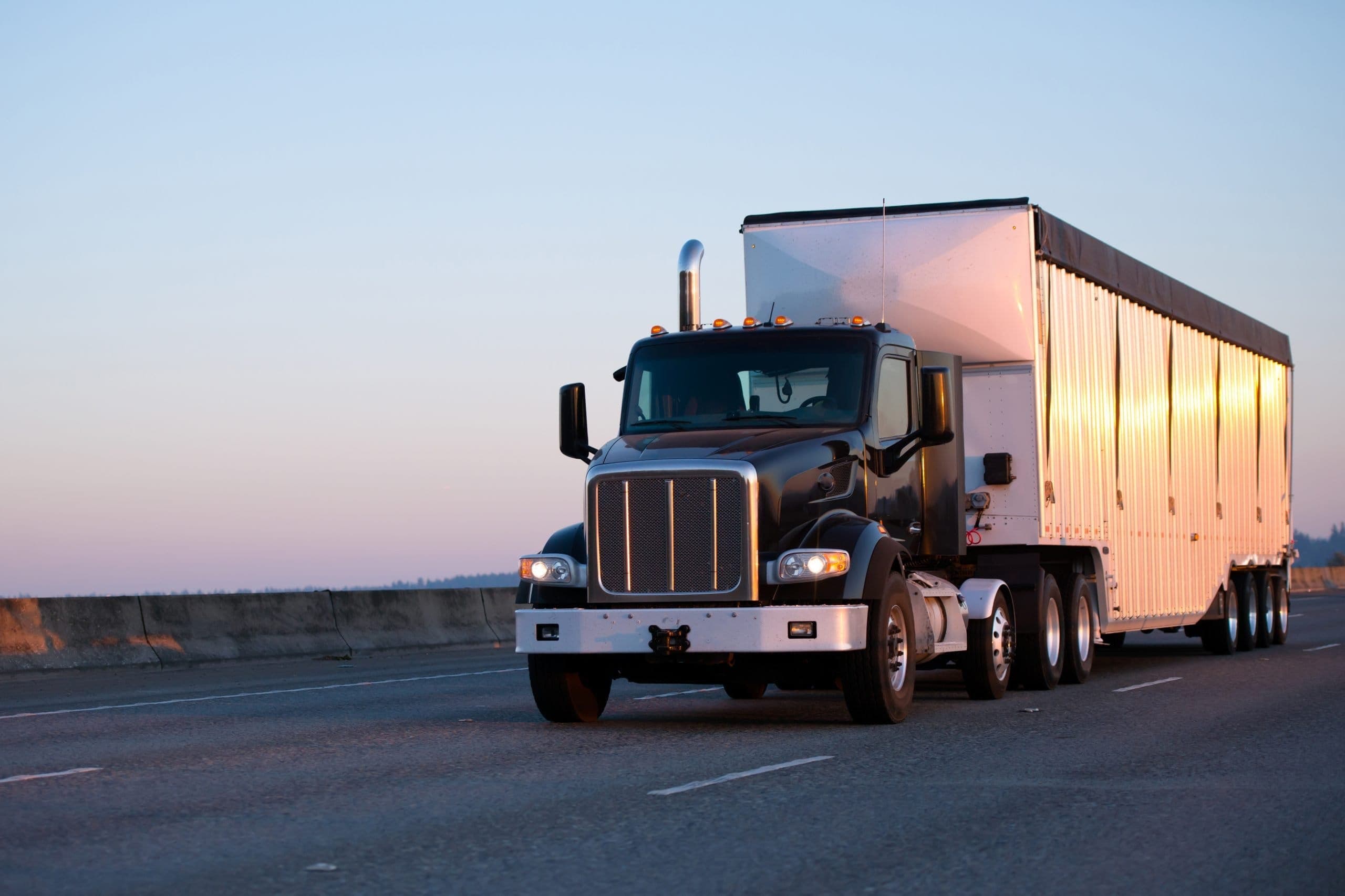 J&A Fleet Maintenance semi-truck and trailer on the highway